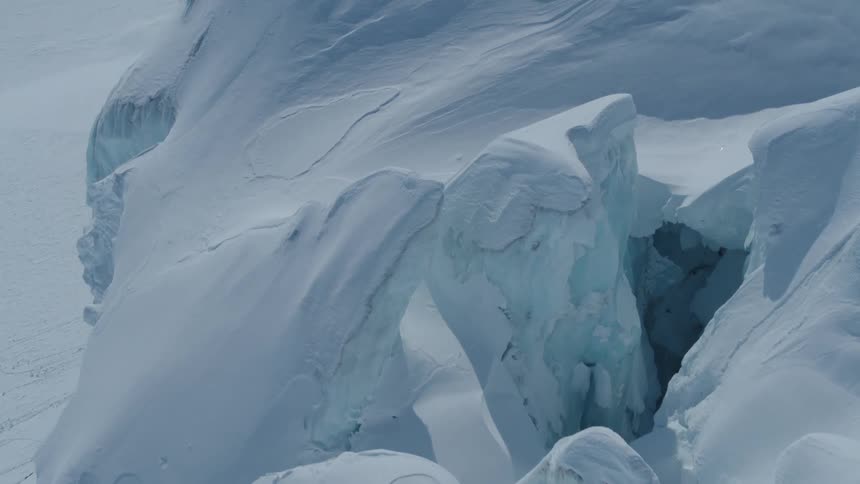 A crevasse on a frozen mountain