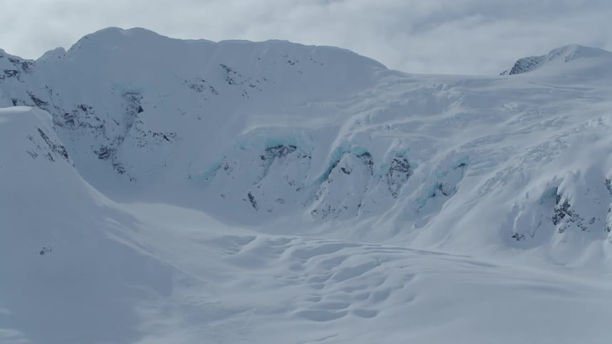 A snow covered mountain plateau