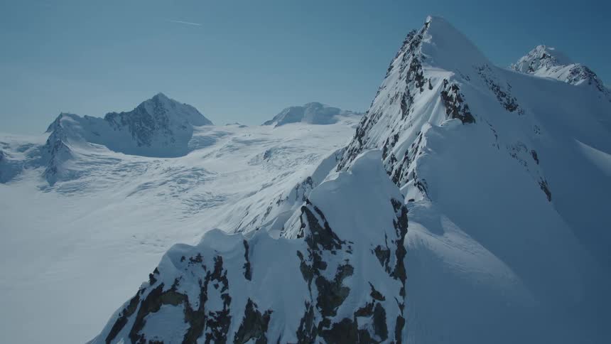 Aerial view of snow capped peaks and mountains