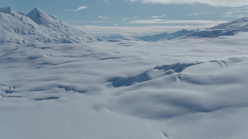 Landscape covered by layer of snow with mountains