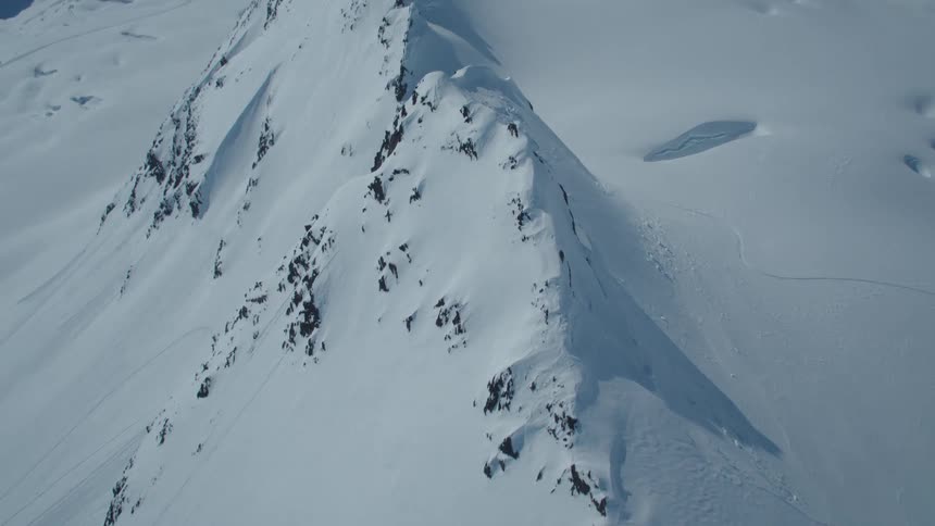 An aerial clip of an arctic mountain tip
