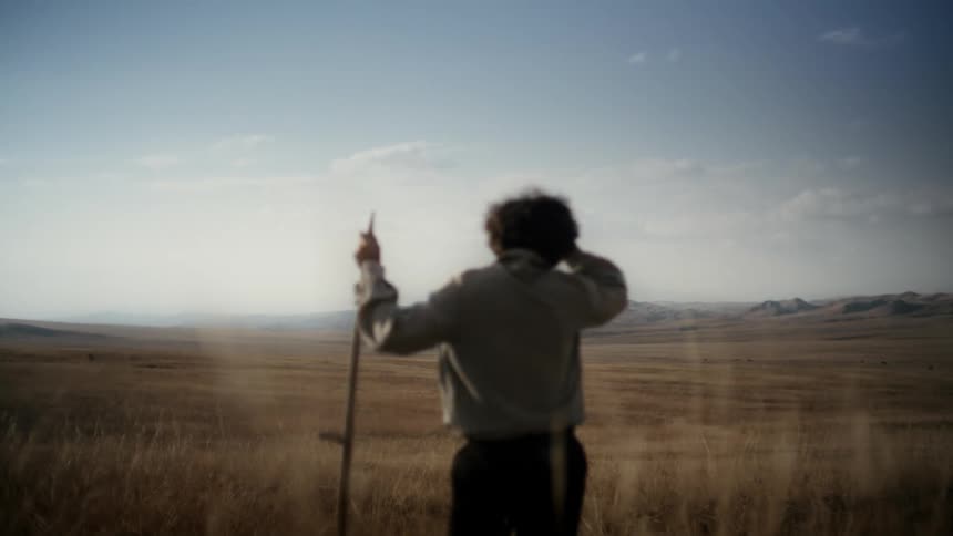 Man weeding a vast field and then running away