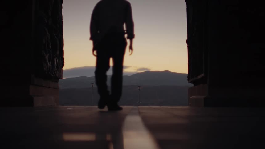 A clip of a male walking towards the entrance