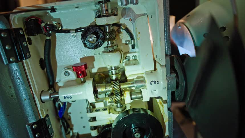A closeup view of the intricate inner workings of a film projector