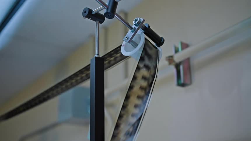 Close up of equipment with a retro film reel running