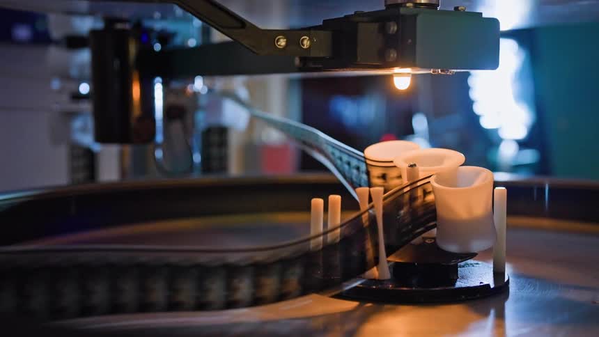 A film projector with a reel of film running through it
