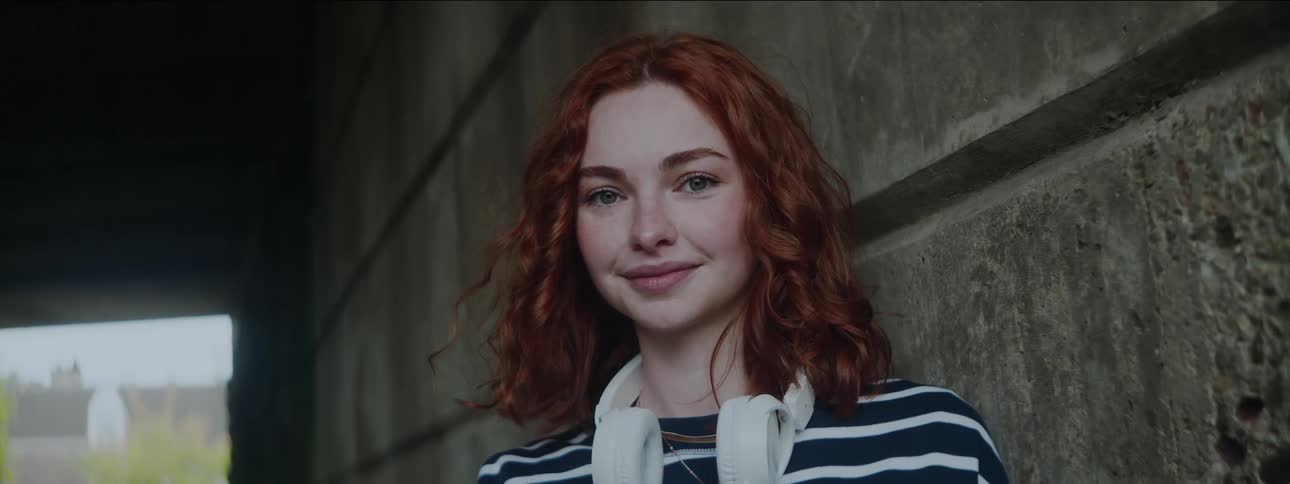 Portrait of a young lighteyed redhaired woman