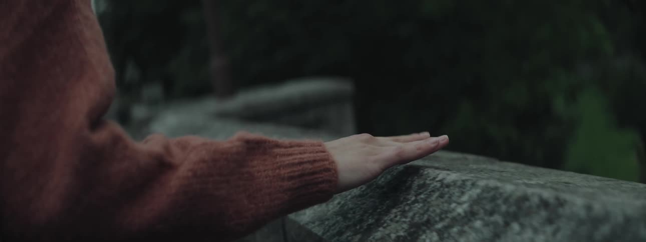 A close up clip of a hand moving on a handrail