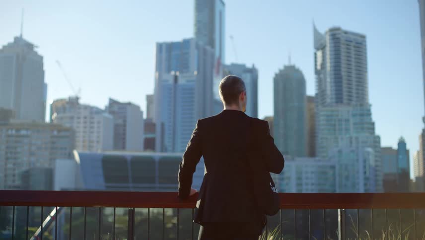 A clip of a man standing by an handrail