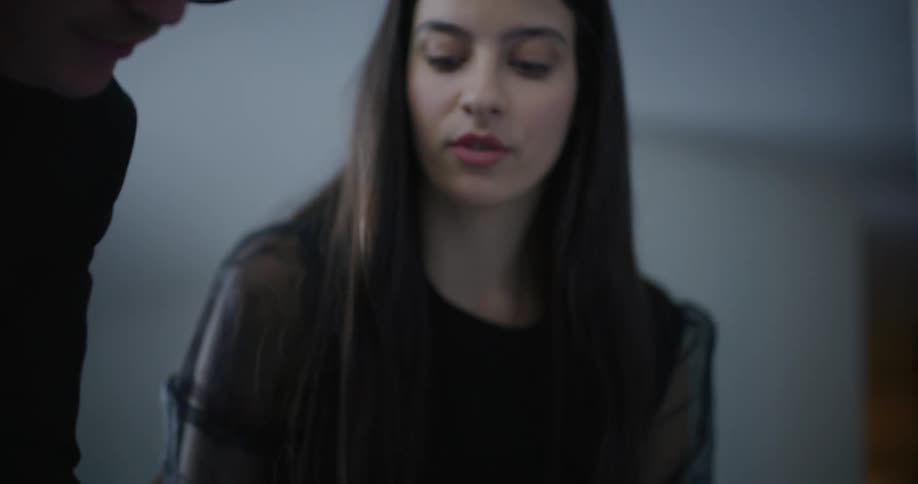 Portrait of a woman talking to a colleague next to her