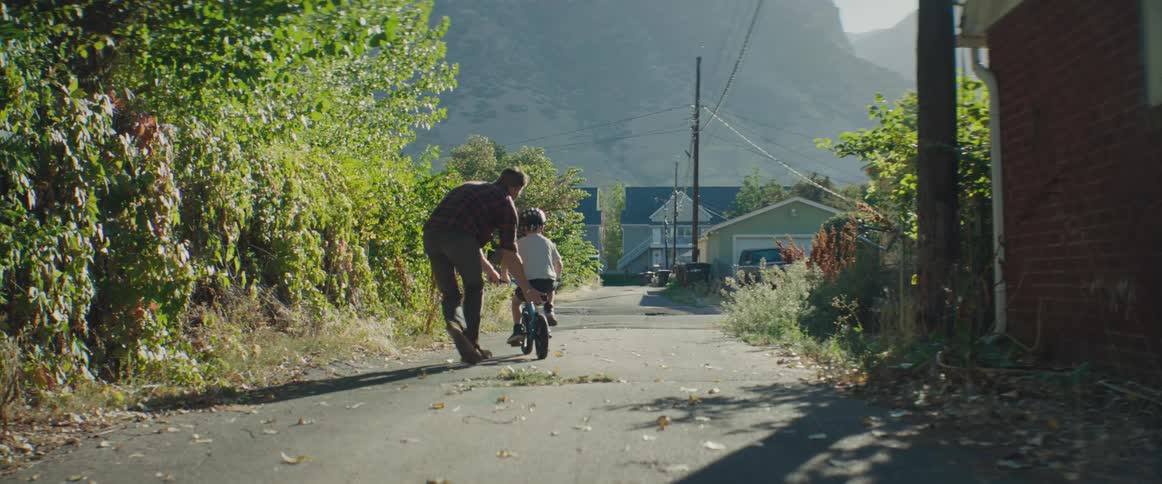 A clip of a father helping a son