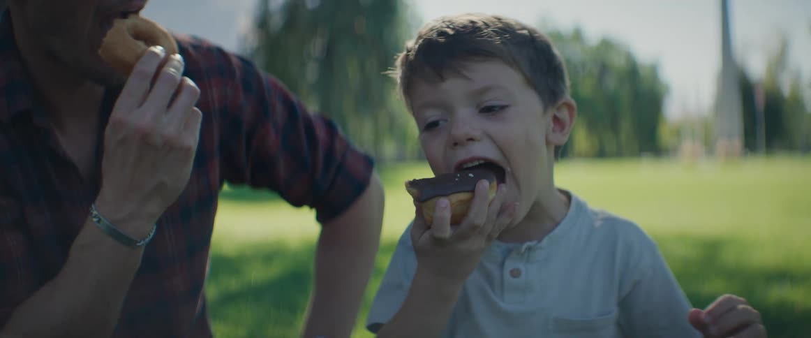 A clip of a father and a son eating