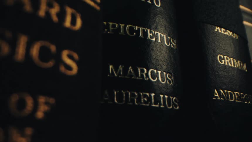 The hardcover of some books with gold writing
