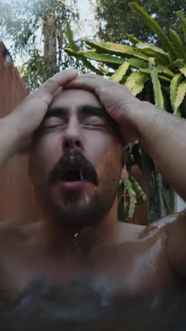Portrait of a man diving into a tub of ice cold water