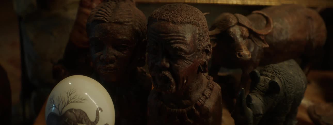Artistic and archaeological faces of people and animals in an indoor environment
