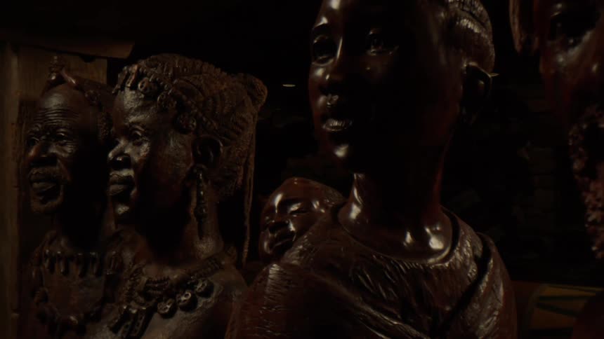 Bronze faces of people on display
