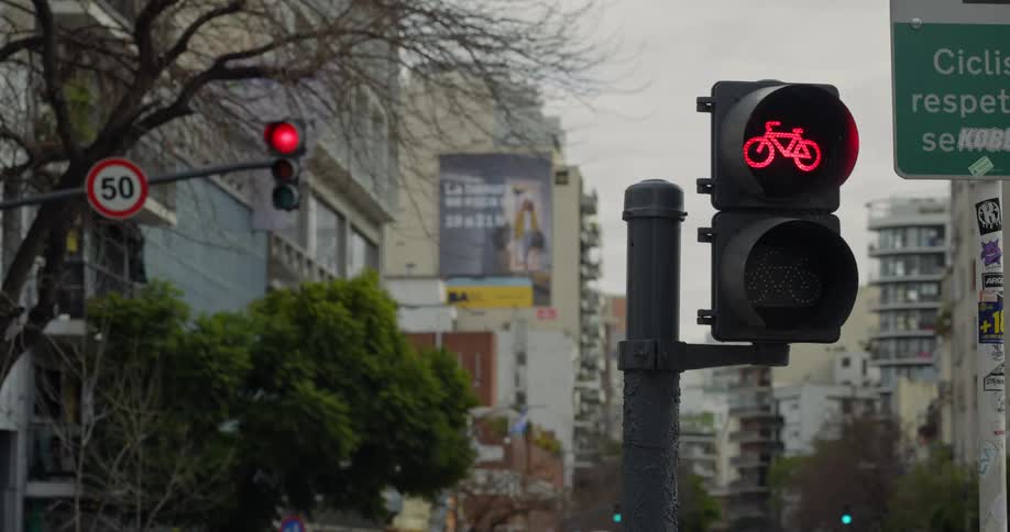Red light for bicycle crossing turns green in a metropolis
