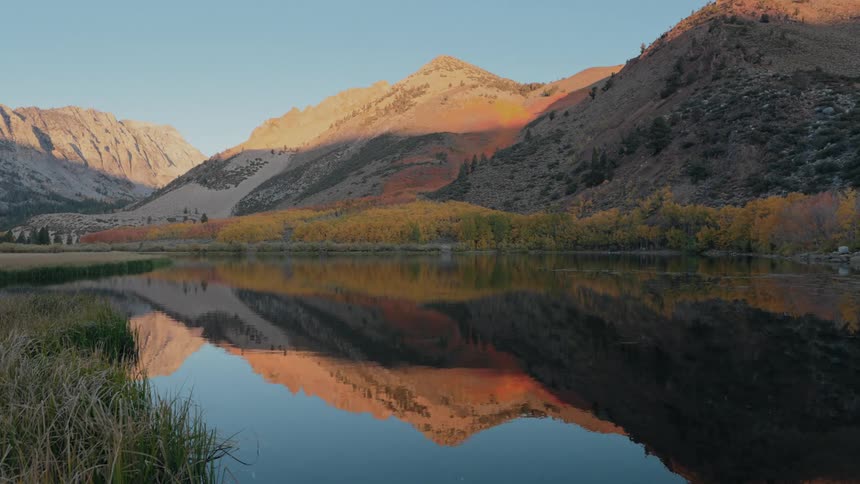The mountain reflects on the lake