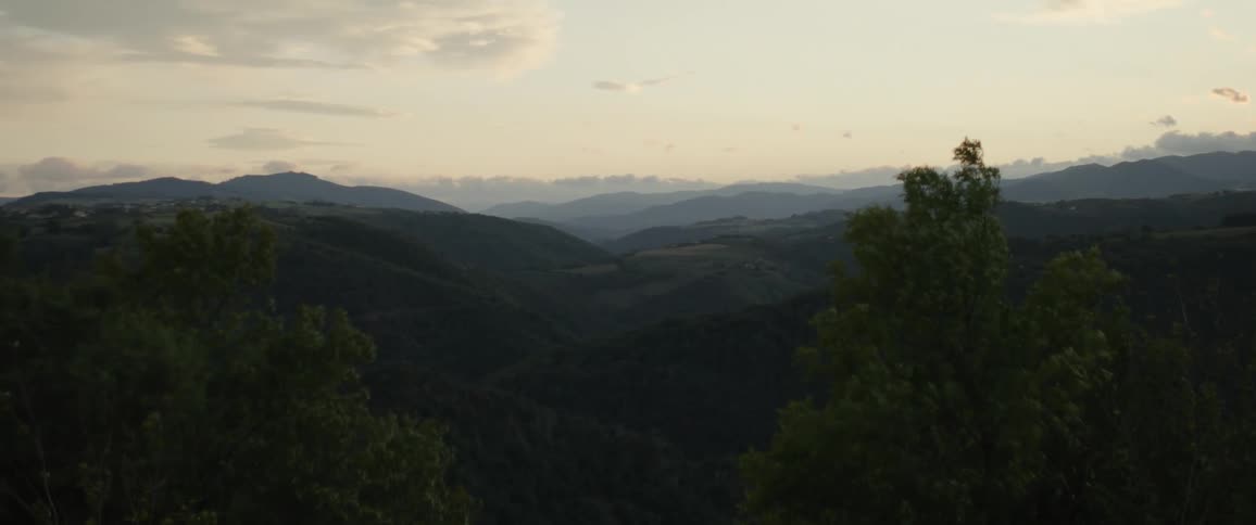 Landscape at dawn with greenish mountain ranges