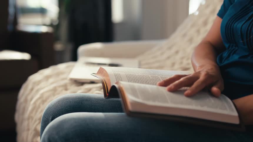Hands of a woman doing a bible study