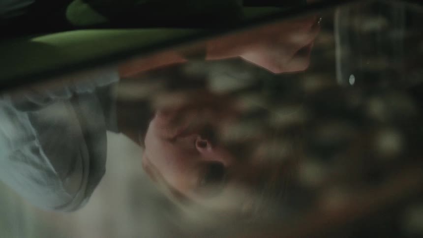 Reflection of a depressed blonde womans face