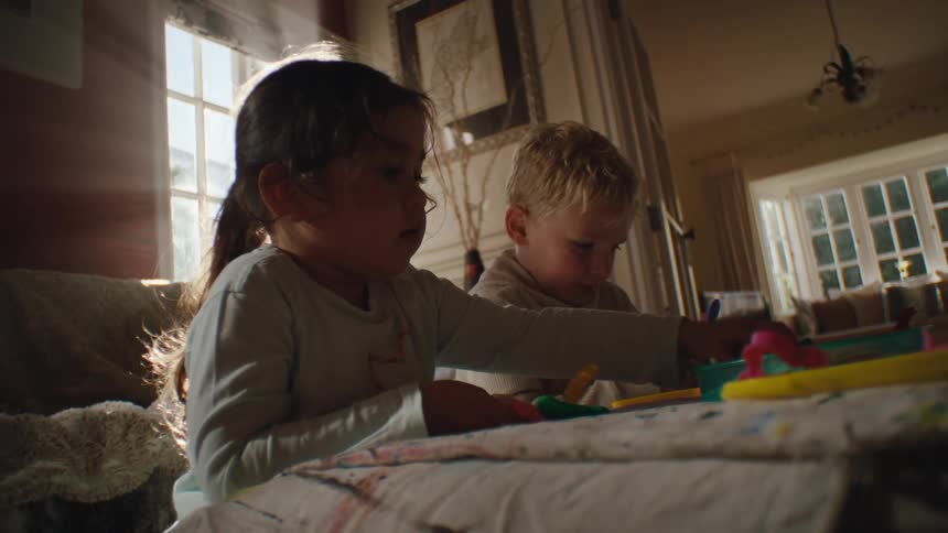 A couple kids play with toys