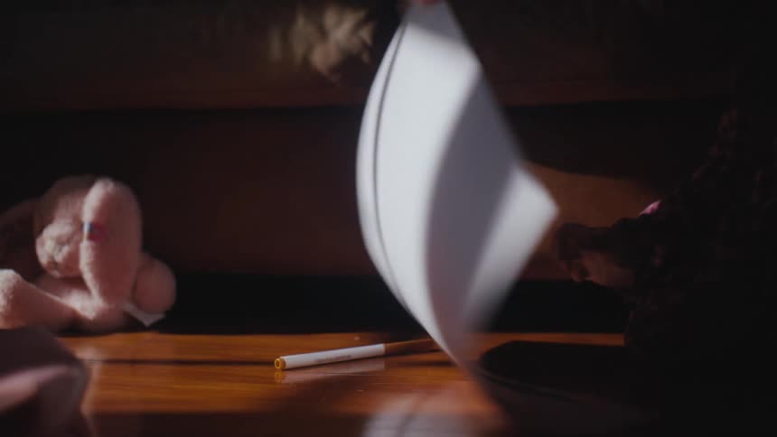 A child pulls up a piece of paper