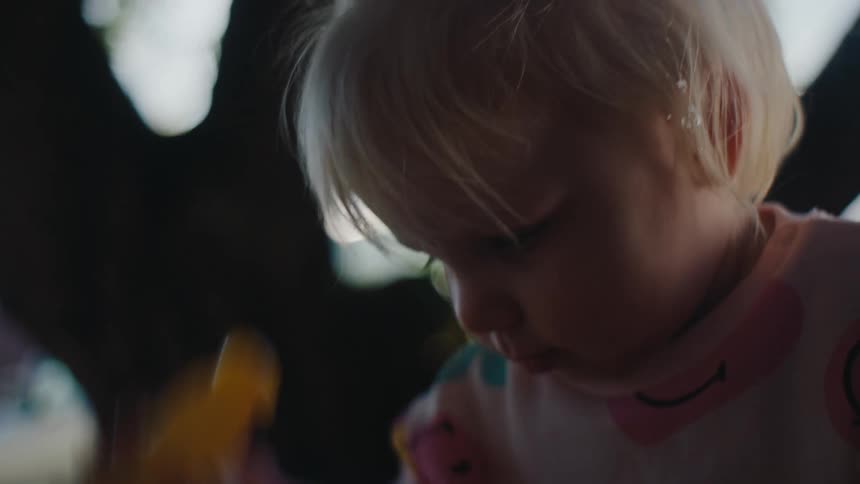 Portrait of a little girl playing in the yard