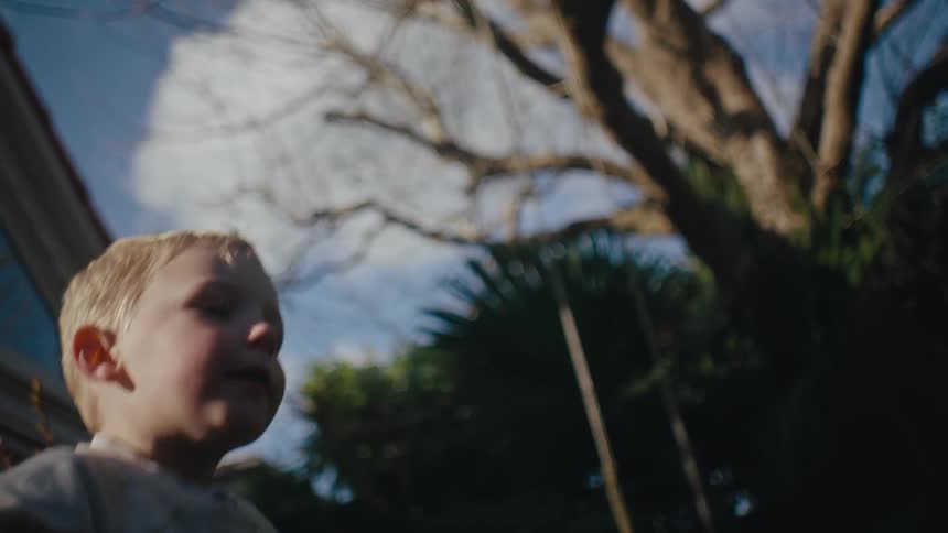 Little boy having fun in the backyard