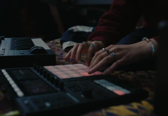 Close up of a female djs hands mixing on a set