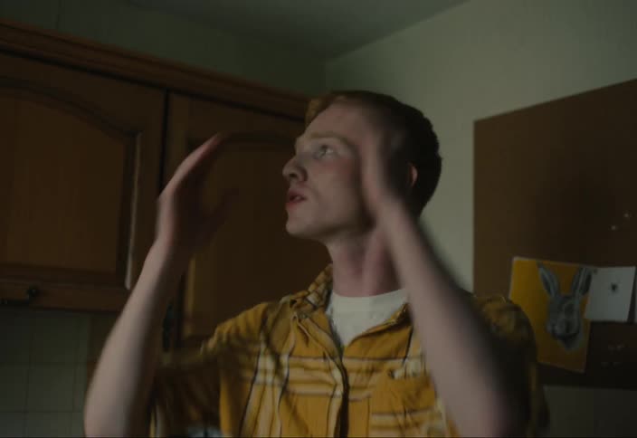 Portrait of a young man in the kitchen arguing