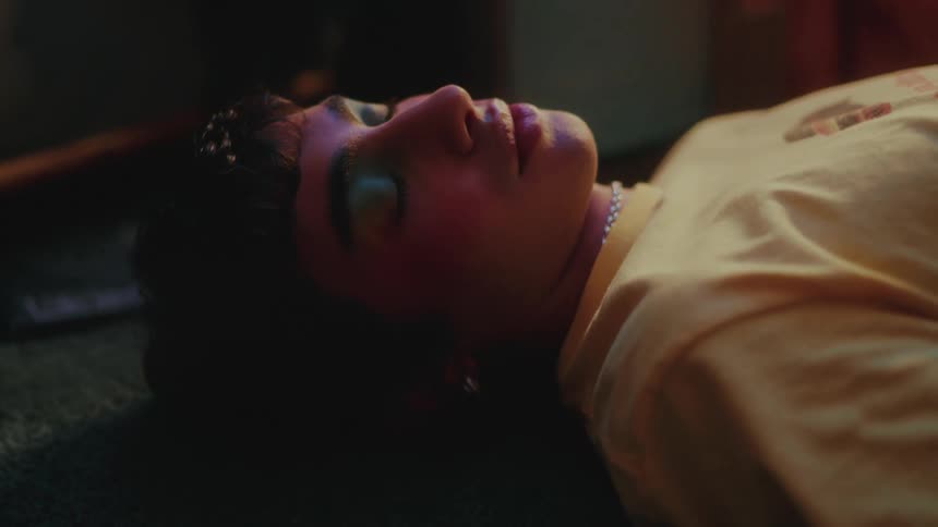 Young person lying on carpet sleepy