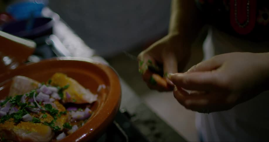 Hands of a person preparing a seasoning
