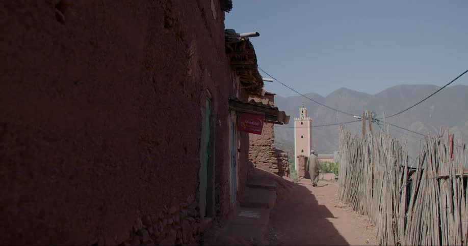 Mud houses in a developing country with views of the mountains in daylight