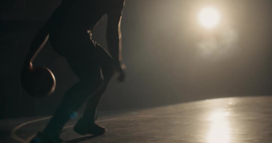 A clip of a basketball player playing in the night