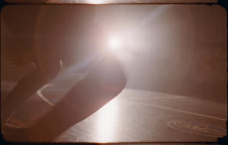 A clip of a person playing basketball on a basketball court