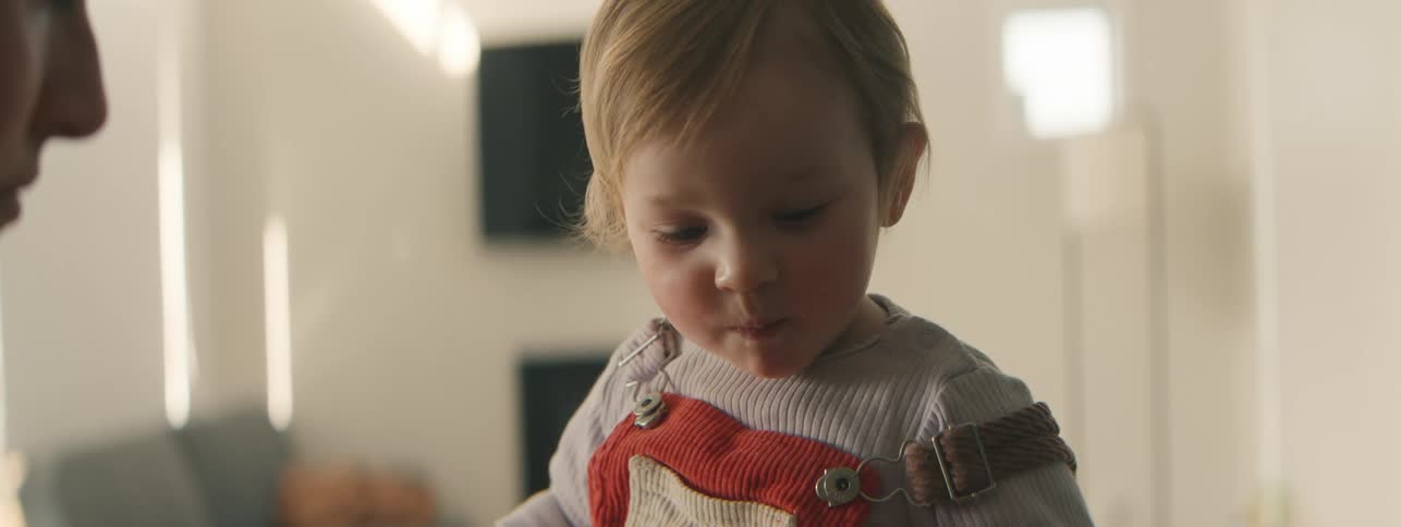 A clip of a mother feeding a baby