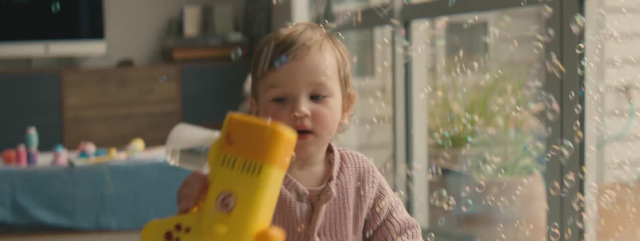 A clip of a kid playing with a bubble gun