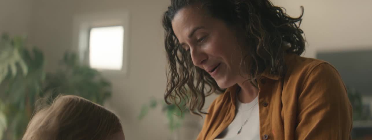 A mother is playing with her daughter