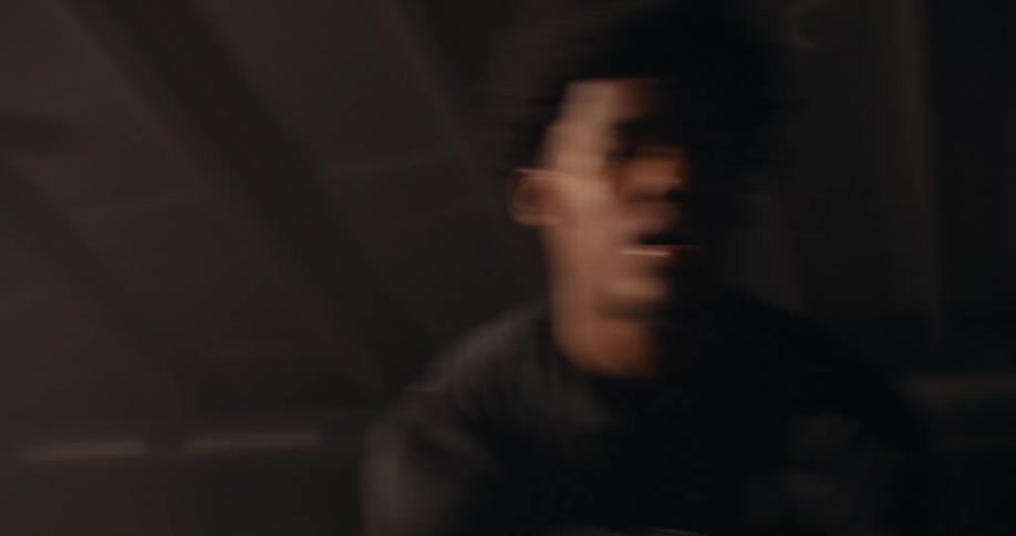 Portrait of a teenager doing basketball moves