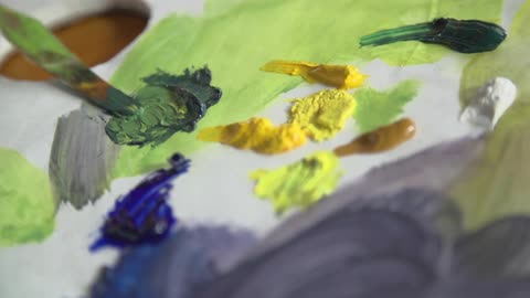 Paint is mixed with a small spatula
