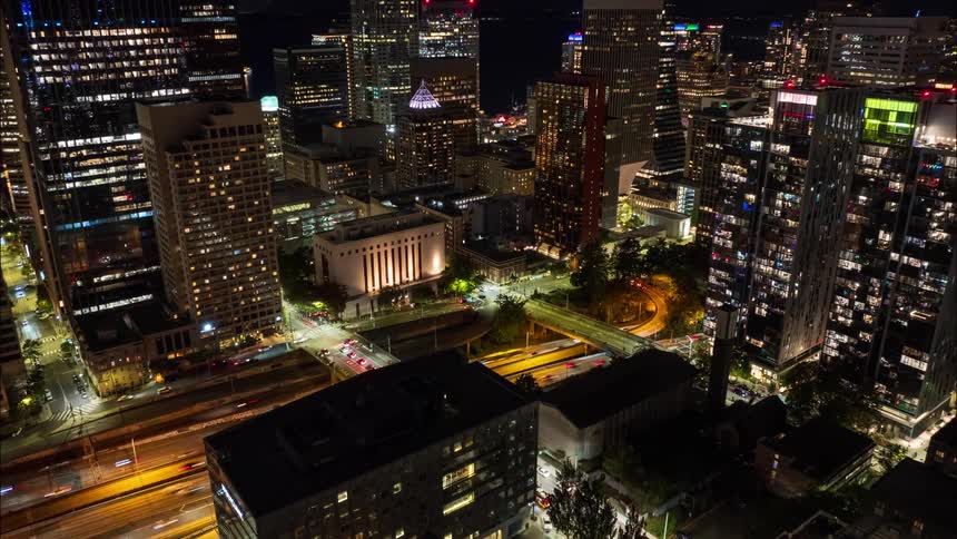 Tilt down traverse though the busy core of downtown Seattle at night