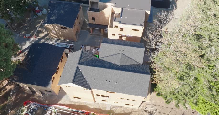 New roofs cover townhomes under construction at a residential development