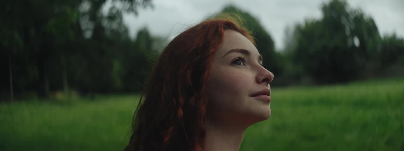 A head clip of a lady in nature