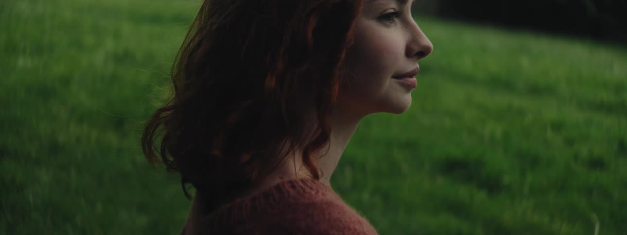 A clip of a lady sitting out in the nature