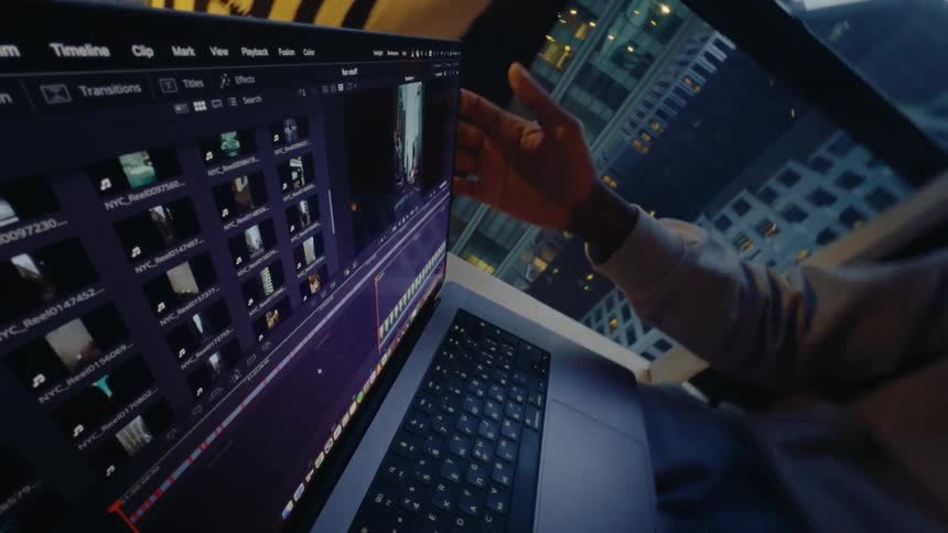 A man types and then closes his laptop