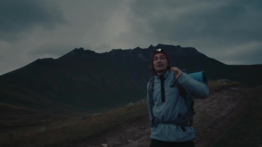 A clip of a male and female hiker walking
