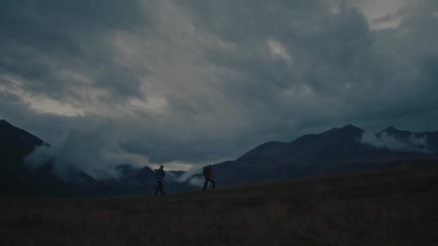 Two people are hiking on the mountains