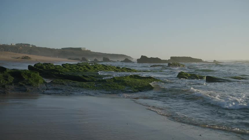Waves crash along the coast