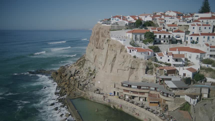 Urban city with classical architecture with white houses in a ruin by the sea